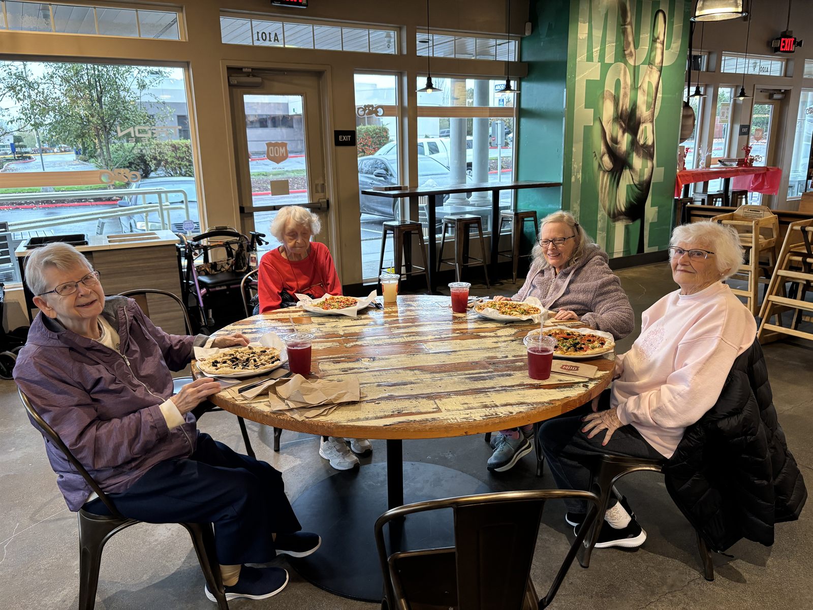 Residents sharing pizza on an afternoon out